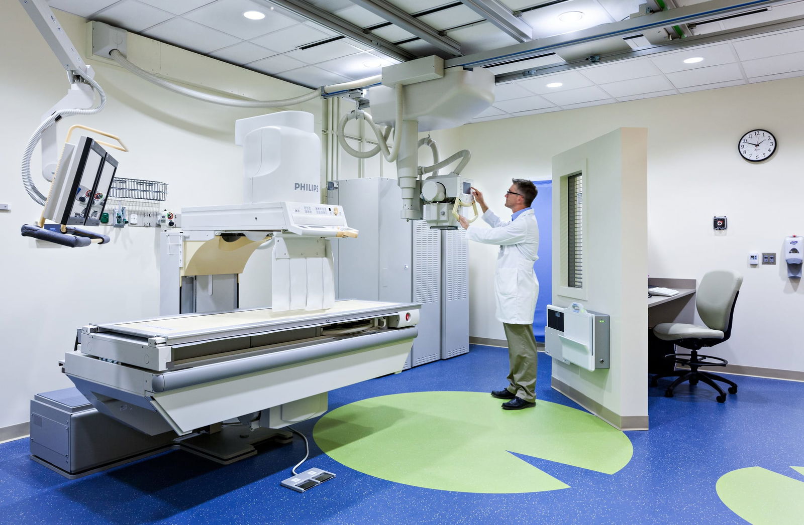 A Riley hospital room featuring a bed, a chair, a television, and a teddy bear placed on the bed. This image showcases BSA's expertise in designing spaces that prioritize patient care.