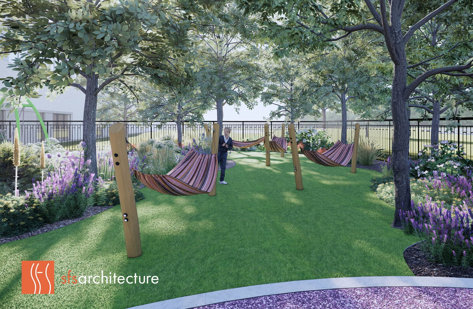 This rendering depicts a thoughtfully designed sensory garden at the Thompson Center, featuring colorful striped hammocks suspended between wooden posts on a manicured lawn. The space is sheltered by mature shade trees and bordered by vibrant purple and white flowering plants. A figure stands in the middle of this therapeutic outdoor environment, which is enclosed by a black fence providing safety while maintaining views to the surrounding landscape. The garden appears designed to offer calming sensory experiences, relaxation spaces, and connection with nature—elements particularly beneficial for individuals with autism and neurodevelopmental conditions. The 